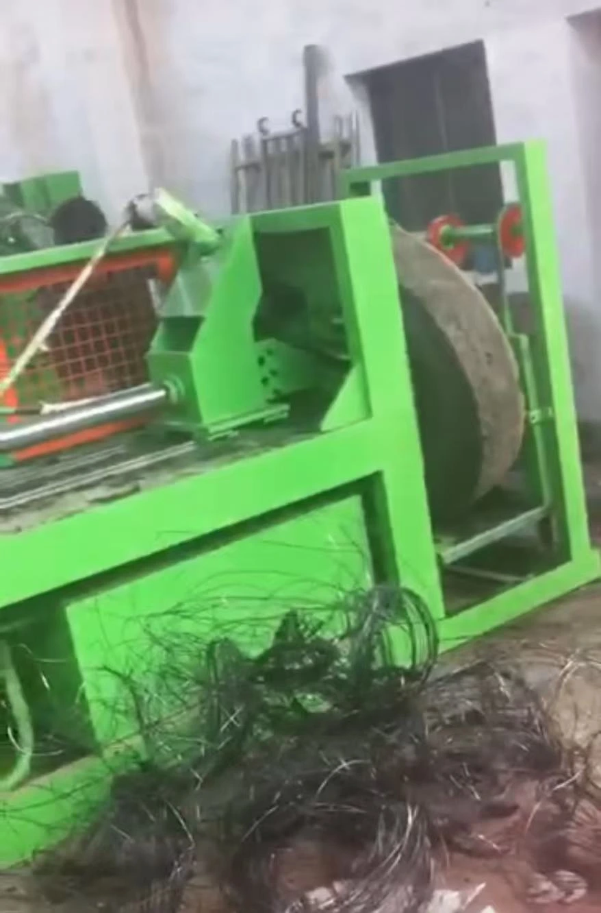 A debeader machine pulling the thick steel ring out of a tire