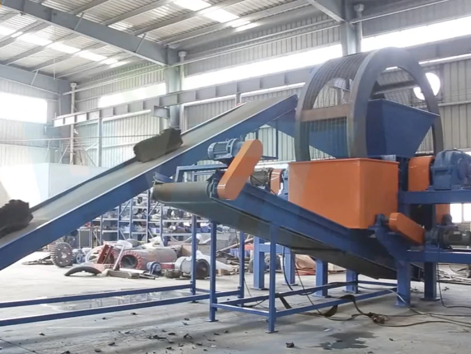 A primary tire shredder with its powerful hooked blades in action