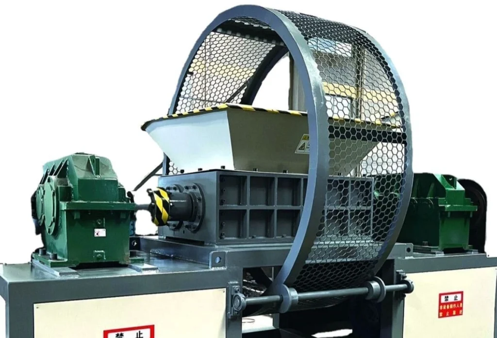 Heavy-duty industrial rubber shredder with protective metal mesh guard