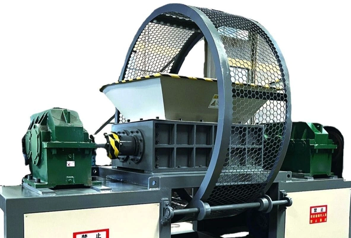 Heavy-duty industrial rubber shredder with protective metal mesh guard