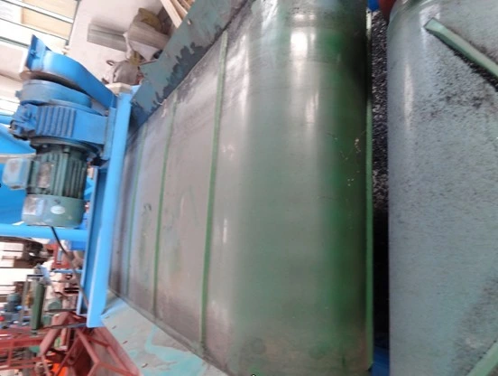 Green conveyor belt for rubber processing in a factory